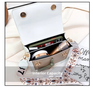 Detail view of the spacious inner compartment showing phone and makeup storage