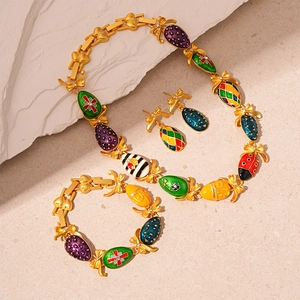 Vintage enamel jewelry set with butterfly knot and colorful beetle egg pendants