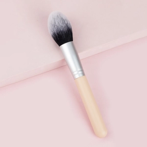 Detailed macro view of soft dual-tone synthetic bristles on an elegant makeup brush