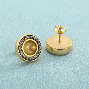 Golden round stainless steel stud earrings with silver twisted rope design and metal backings