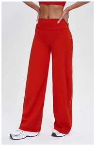 Detailed front view of high-waisted wide-leg yoga pants in vibrant red sportswear fabric