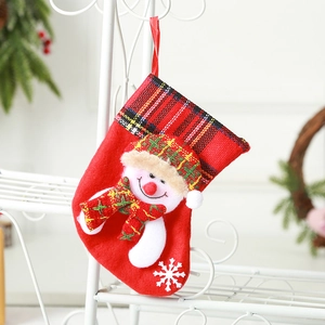 Red Christmas stocking featuring a 3D snowman with plaid trim and snowflake pattern