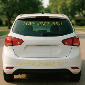 Close-up of golden glitter letter stickers showing Love Since 2025 text on a car surface