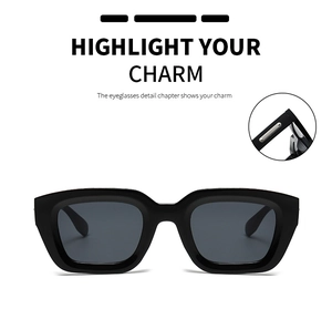 Detail view of stylish black square sunglasses with silver metal hinges and dark grey lenses