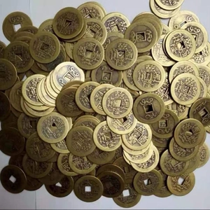 Macro detail of ancient Chinese brass coins showing weathered textures and square holes