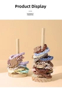 Vertical wooden stand displaying colorful scrunchies and hair ties in macro detail