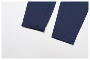 Close-up of double-needle stitching on the hem of dark blue high-elastic yoga pants