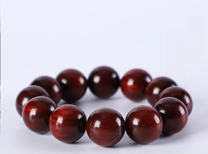 Detailed view of high-density green sandalwood beads highlighting texture and hardness