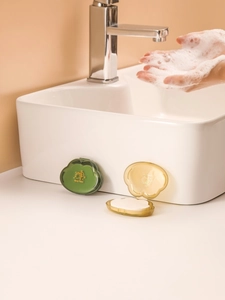 Deep green and amber cloud-shaped travel soap slice containers with rich foam usage