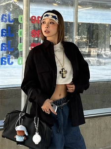 Gothic resin cross pendant long necklace shown with casual urban street style outfit