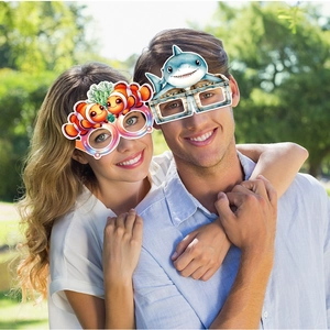 Ocean themed party glasses featuring shark and clownfish designs for birthday celebrations