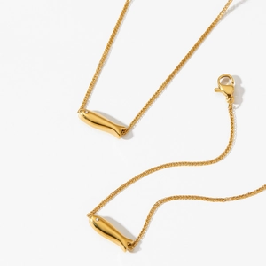Elegant gold stainless steel necklace featuring two dainty fish pendants with small diamonds