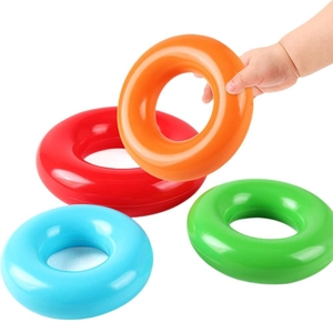 Rainbow stacking ring toy set for babies with colorful plastic circles and soft hand grip