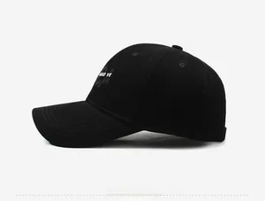 Side view of black cotton baseball cap showing white MAO YE letter embroidery detail