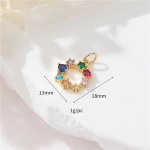 Macro detail of 13mm gold floral ring pendant with multi-color zircon inlay for DIY