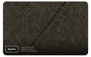 Detailed close-up of heavy-duty stitching on thick wool fabric for winter men's baseball caps
