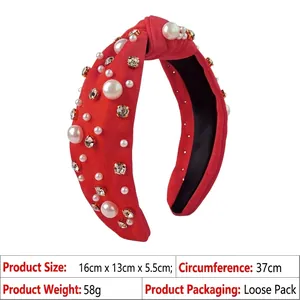 Detailed view of red knotted headband with pearls, rhinestones and size specifications