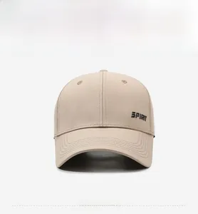 Detailed close-up of beige baseball cap featuring black 3D Spirit letter embroidery