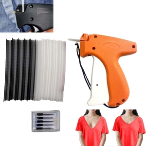 Detail view of the garment tag gun kit including needles and plastic fasteners