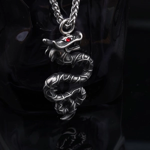 Retro stainless steel silver dragon pendant necklace with red rhinestone eye on black base