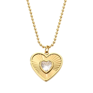 Golden heart pendant necklace with radiant texture and crystal on beaded chain