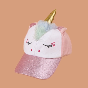 Detailed close-up of a pink unicorn baseball cap with gold horn and sequins