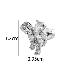 Bow-shaped zircon screw back ear stud in silver metal, measuring 1.2cm by 0.95cm