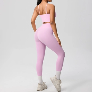 Detail of cross back yoga set featuring thin straps and high-waist peach leggings