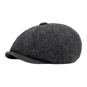 Classic dark grey herringbone newsboy cap with a vintage British style side view