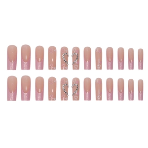 Long coffin press-on nails with pink glitter French tips, hearts and rhinestones