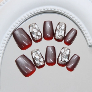 Handmade burgundy cat eye press-on nails with sparkling rhinestones and silver glitter