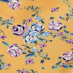 Macro shot of ginger floral print on diagonal twill fabric for an asymmetric dress