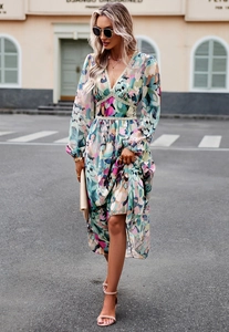 Detail of floral V-neck long sleeve dress with lace trim and elastic waist on model
