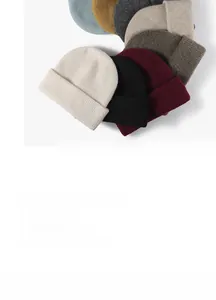 Detailed view of various colorful ribbed knit beanies stacked in a circular arrangement