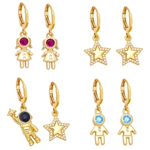 Detail view of assorted gold-plated earrings with colorful zircon stones in various shapes