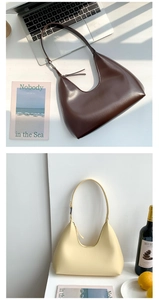 Detail showing dark brown and beige minimalist PU leather crescent shoulder bags with light shadows