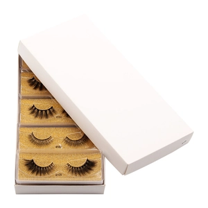 Detailed view of 5 pairs of 3D faux mink lashes in a gold glitter tray box