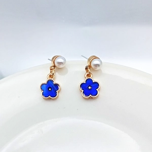 Elegant S925 silver needle blue flower stud earrings with pearls on white porcelain