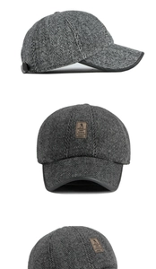Detail view of winter baseball cap showing grey herringbone fabric and leather logo patch