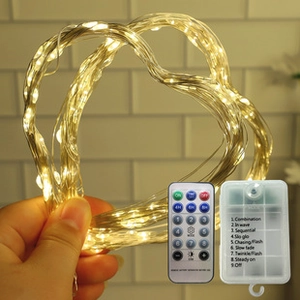 Detail view of LED copper wire lights with 8-mode remote control and battery box