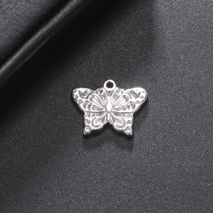 Polished silver stainless steel butterfly pendant with intricate hollow cut-out design