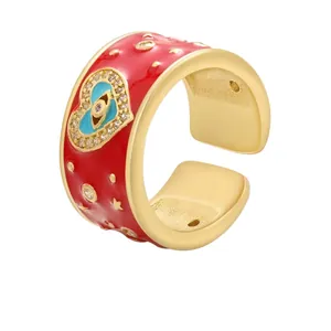 Adjustable golden brass open ring with red enamel finish and heart evil eye pattern