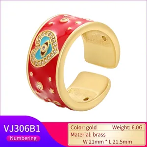 Adjustable golden brass open ring with red enamel finish and heart evil eye pattern