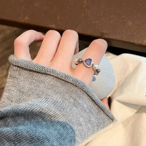 Elegant purple heart gemstone ring with gray pearls and sparkling zircon accents
