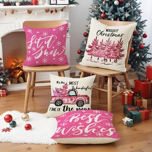 Pink Christmas truck linen pillow covers set of 4 shown in cozy festive interior decor