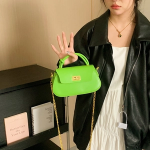 Neon green square leather mini bag with golden chain strap and twist lock closure