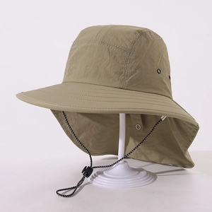 Detail view of khaki sun hat featuring breathable metal eyelets and adjustable wind cord