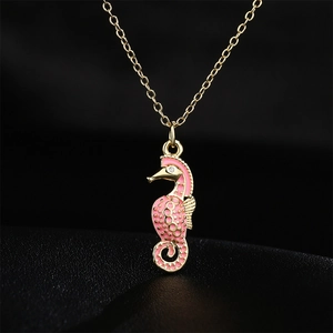 Chic 18K gold plated necklace featuring a seahorse pendant with pink enamel and crystals