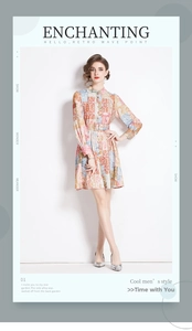Detail of vintage printed long-sleeve midi dress with stand collar and waist belt
