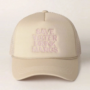 Detailed close-up of beige trucker hat with pink Save Water Drink Margs embroidery
